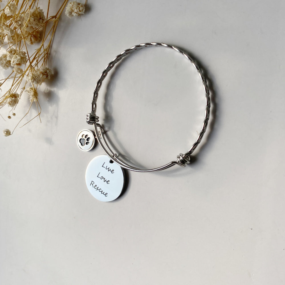 Stainless Steel “Live Love Rescue” Paw Bangle – Adjustable